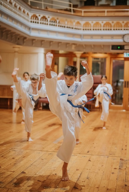 Students stretching before karate class
